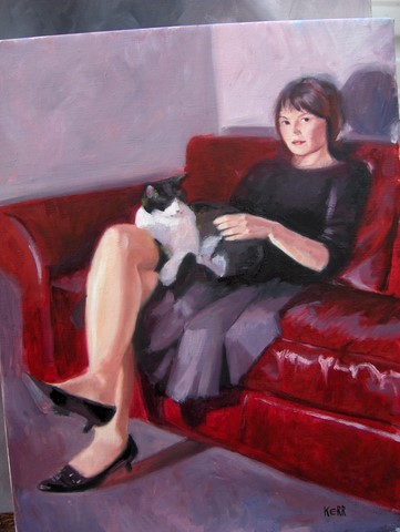 girl on sofa with cat