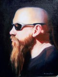portrait of man with shaved head, and beard